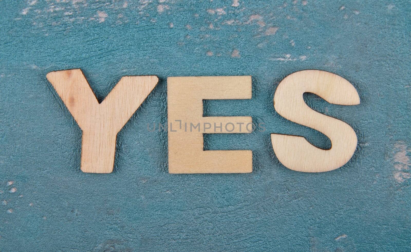 Term from wooden letters on weathered concrete