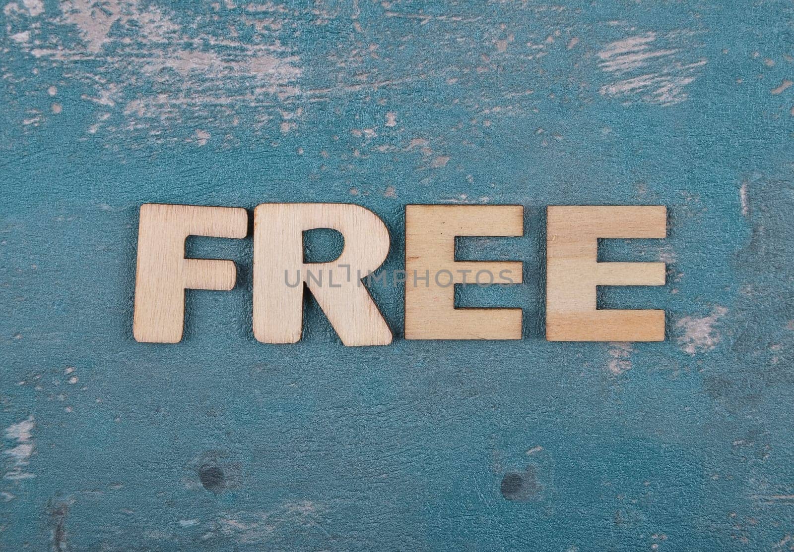 Term from wooden letters on weathered concrete