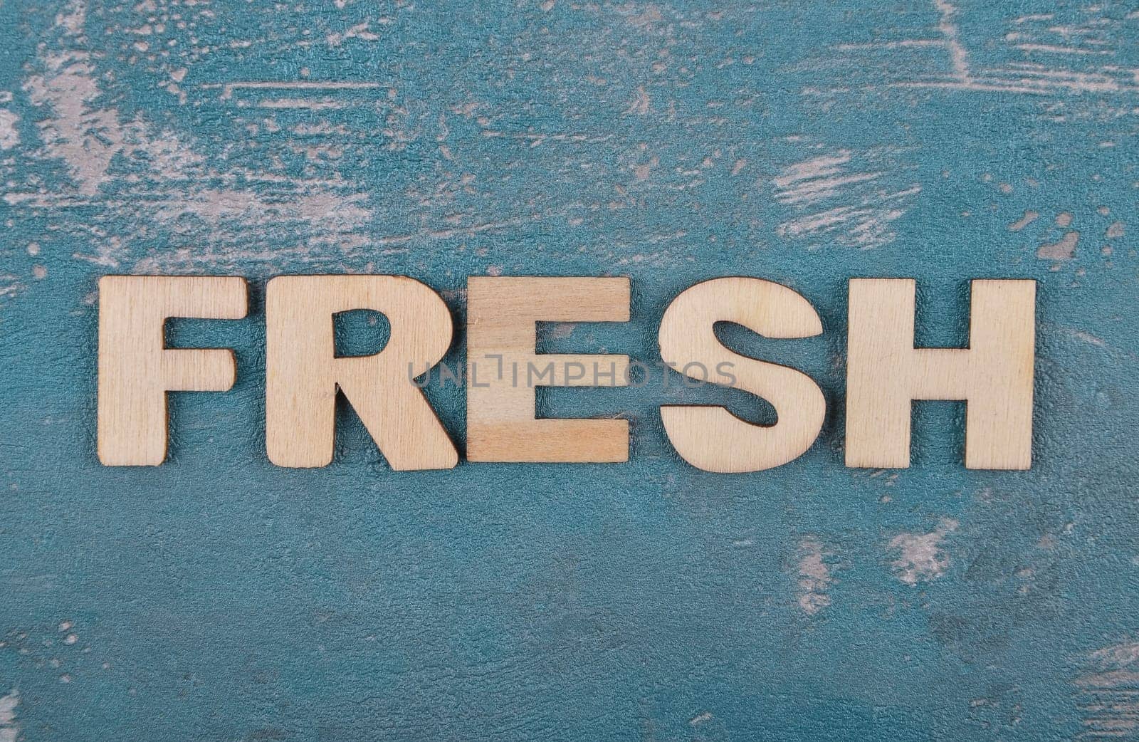 Term from wooden letters on weathered concrete