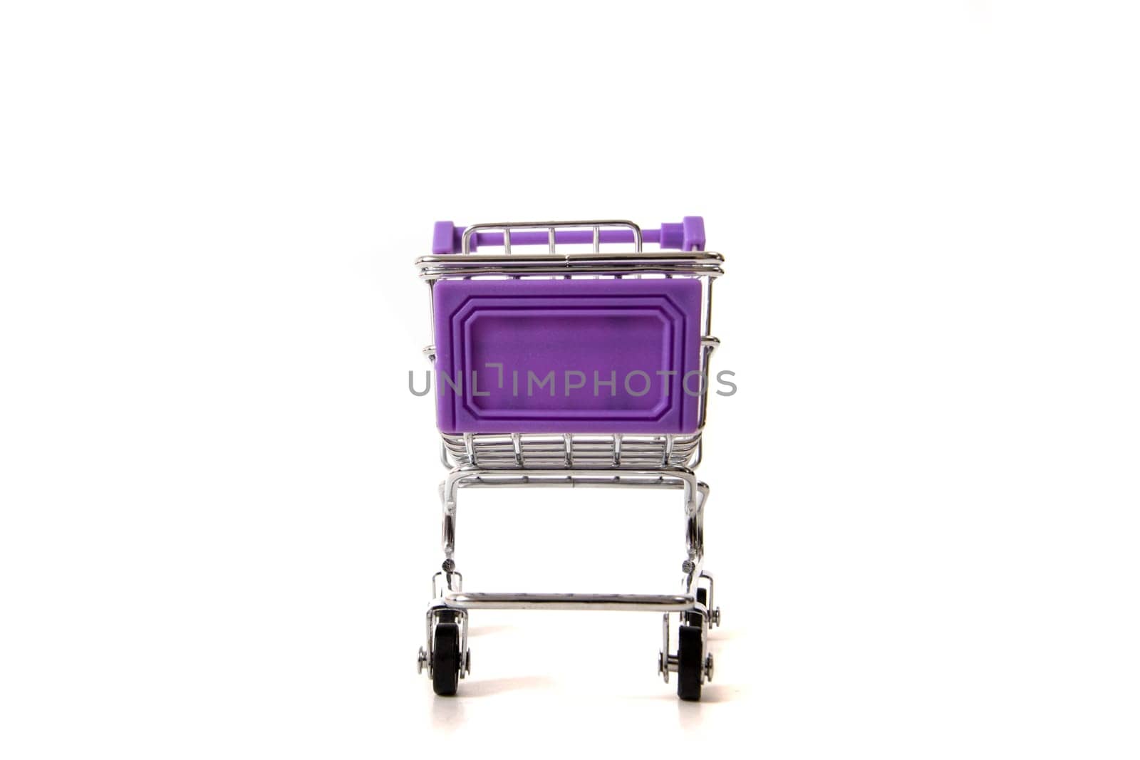 Miniature shopping cart isolated on white background.