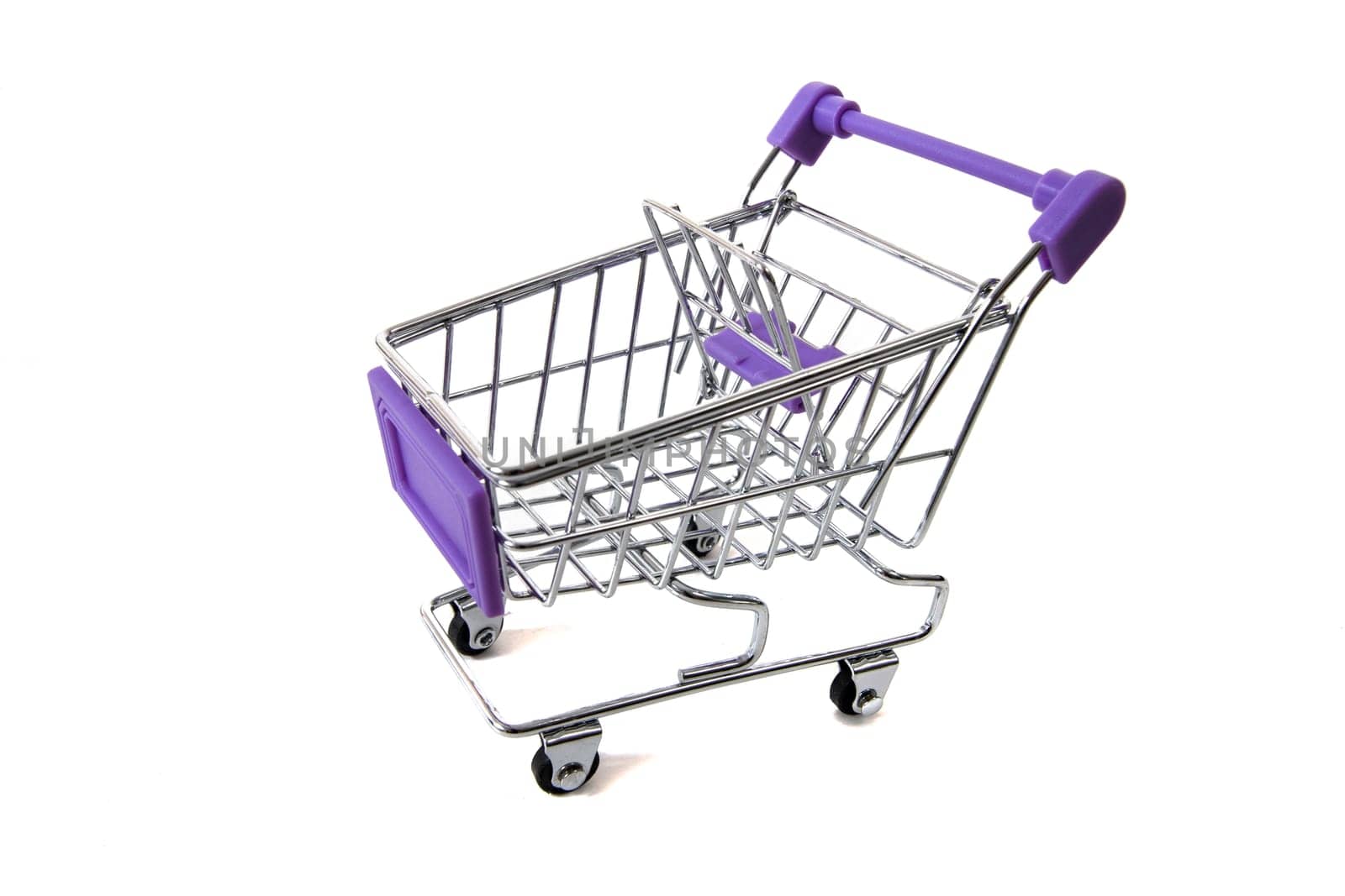 Miniature shopping cart isolated on white background.