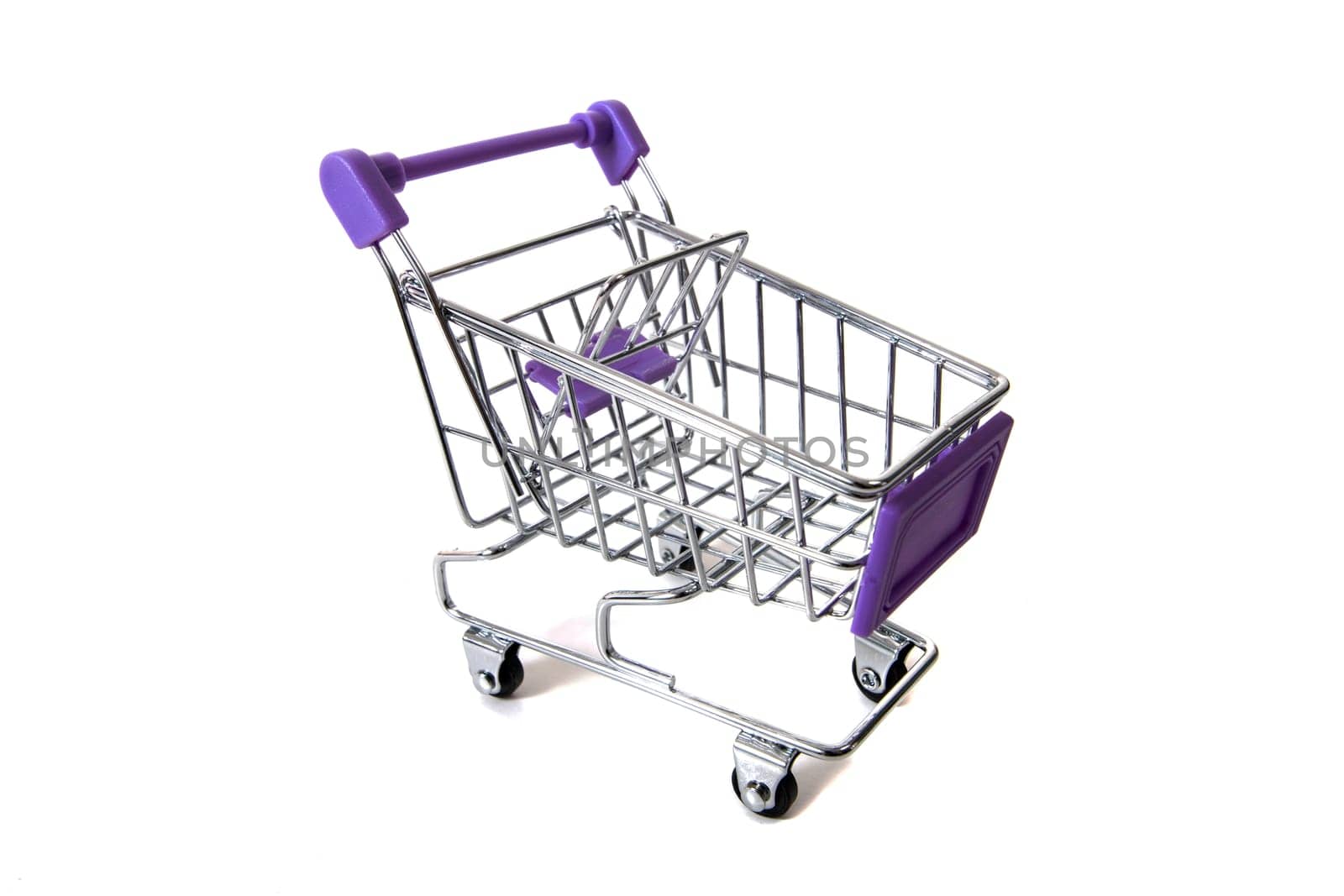 Miniature shopping cart isolated on white background.