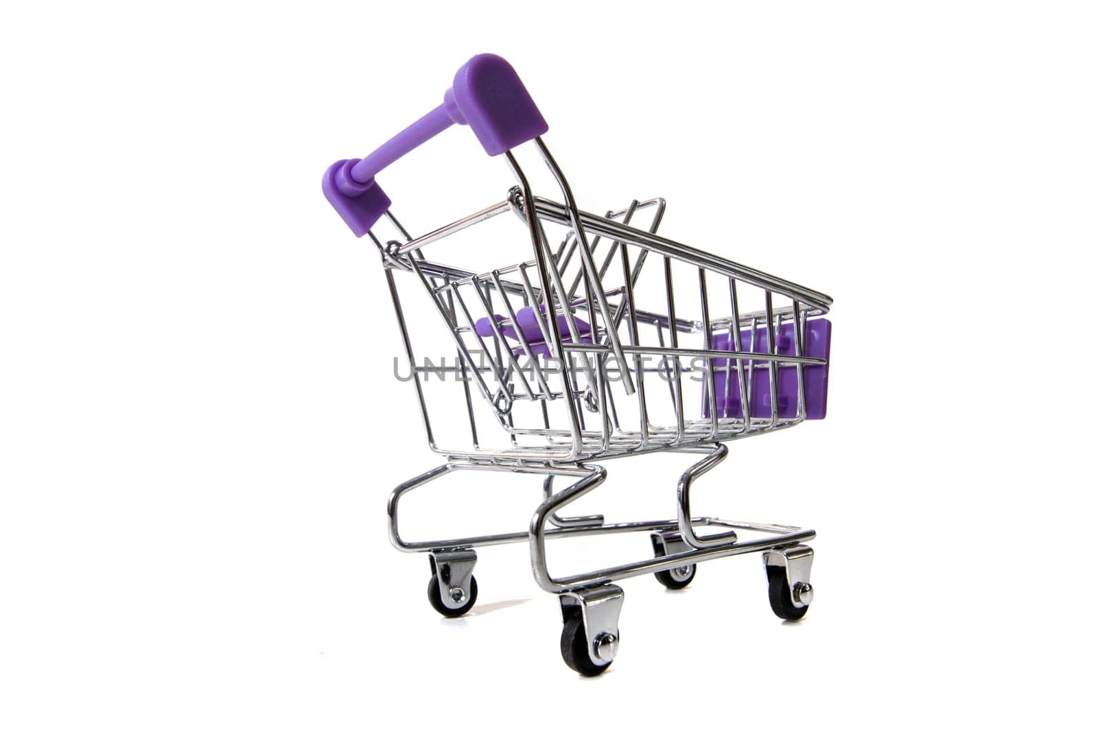 Miniature shopping cart isolated on white background.