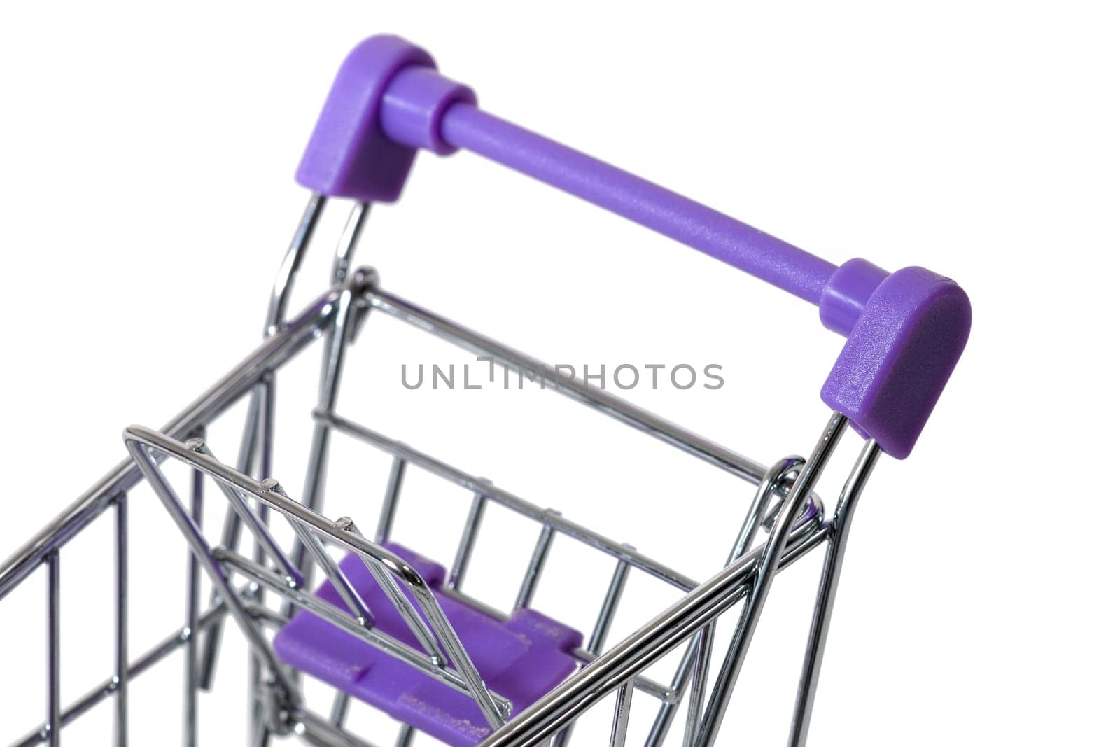 Miniature shopping cart isolated on white background.