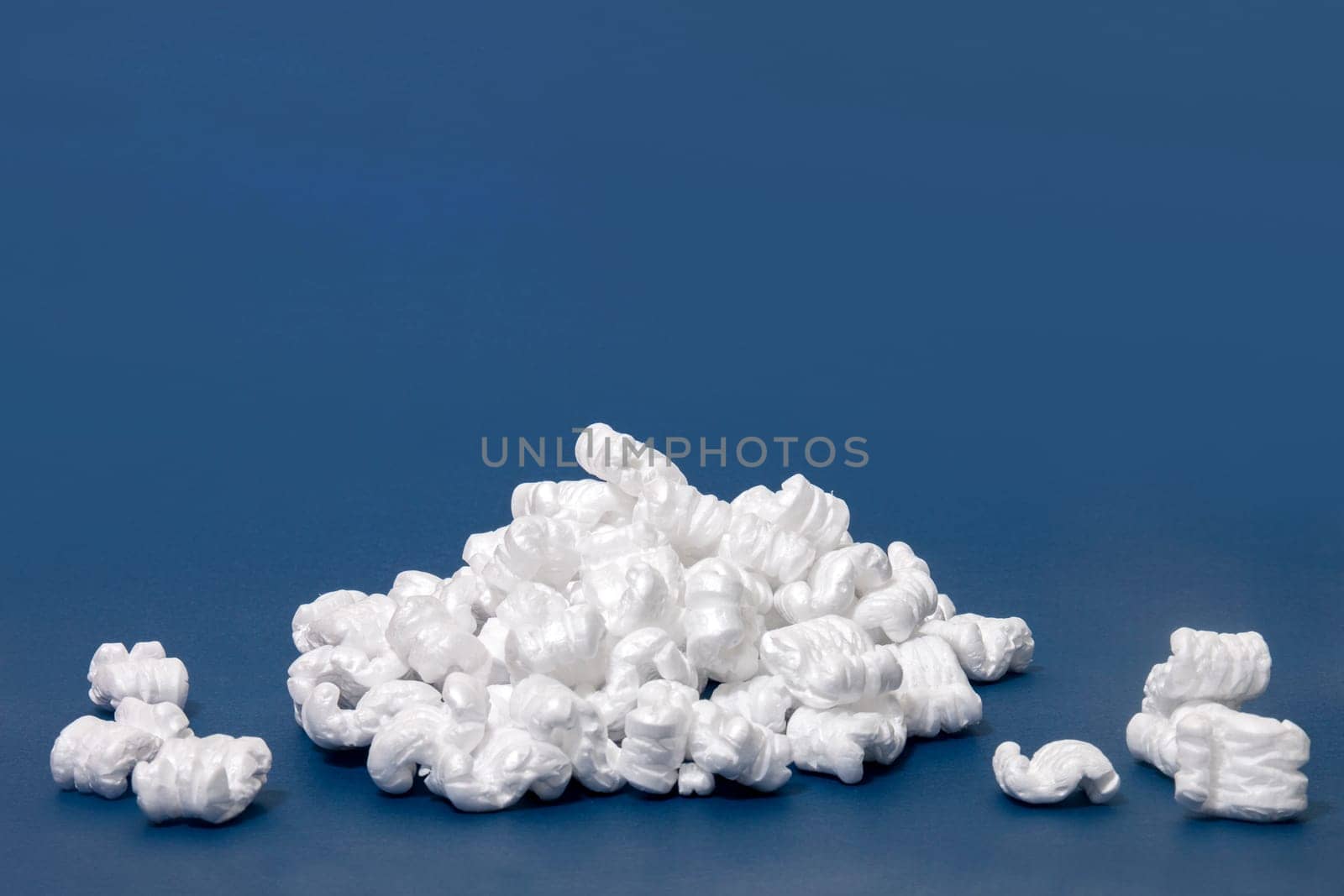 Polystyrene or white styrofoam packing pieces used for minimize bumps in transportation of goods.