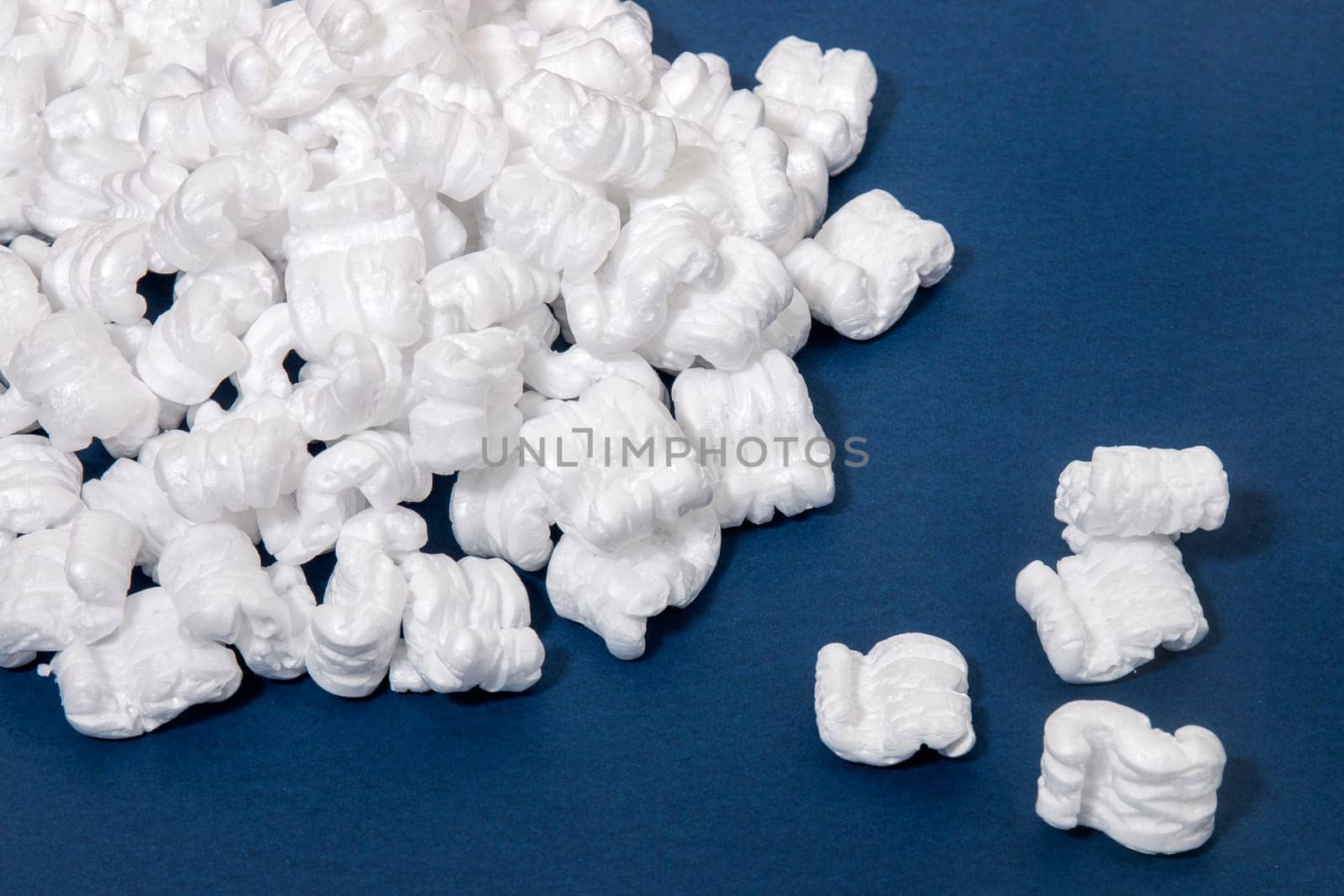 Polystyrene or white styrofoam packing pieces used for minimize bumps in transportation of goods.
