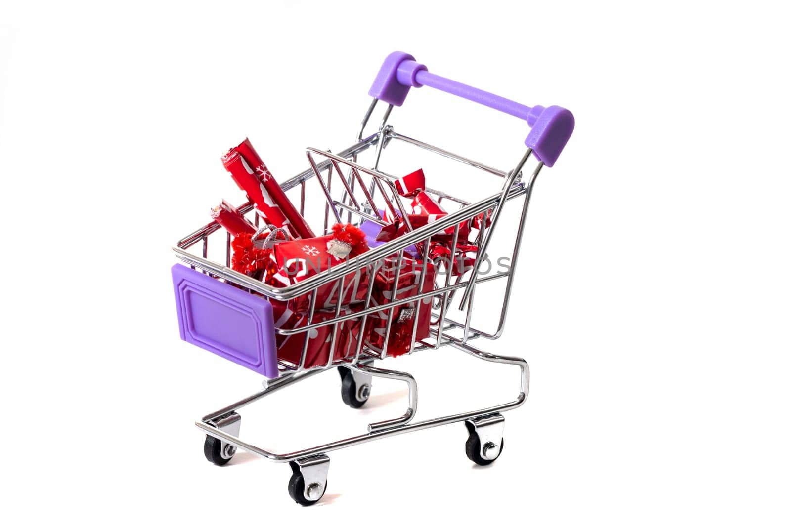 Miniature shopping cart isolated on white background.