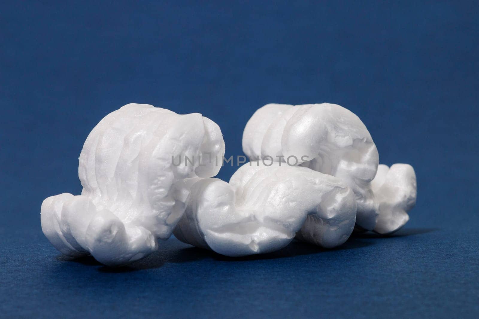 Polystyrene or white styrofoam packing pieces used for minimize bumps in transportation of goods.