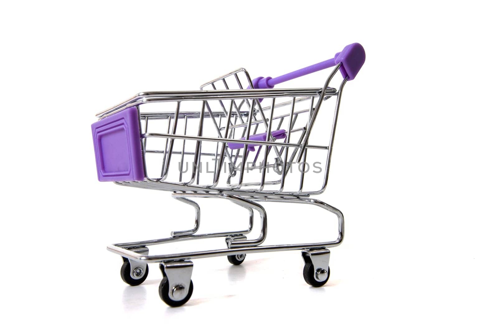 Miniature shopping cart isolated on white background.