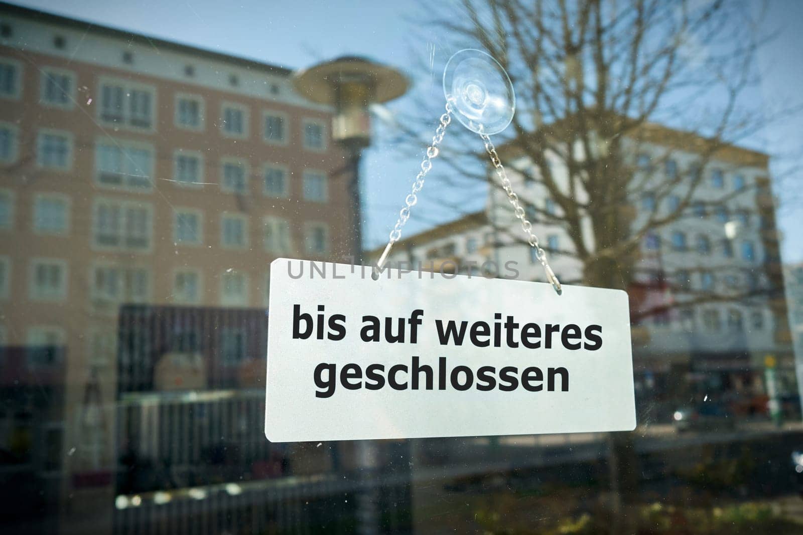 Sign on a shop window with the inscription closed until further notice