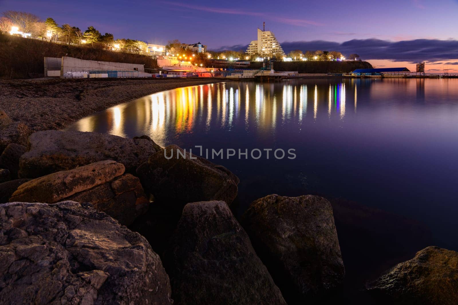 Anapa, Russia - February 17, 2020: View of the small bay of the city of Anapa resort after sunset