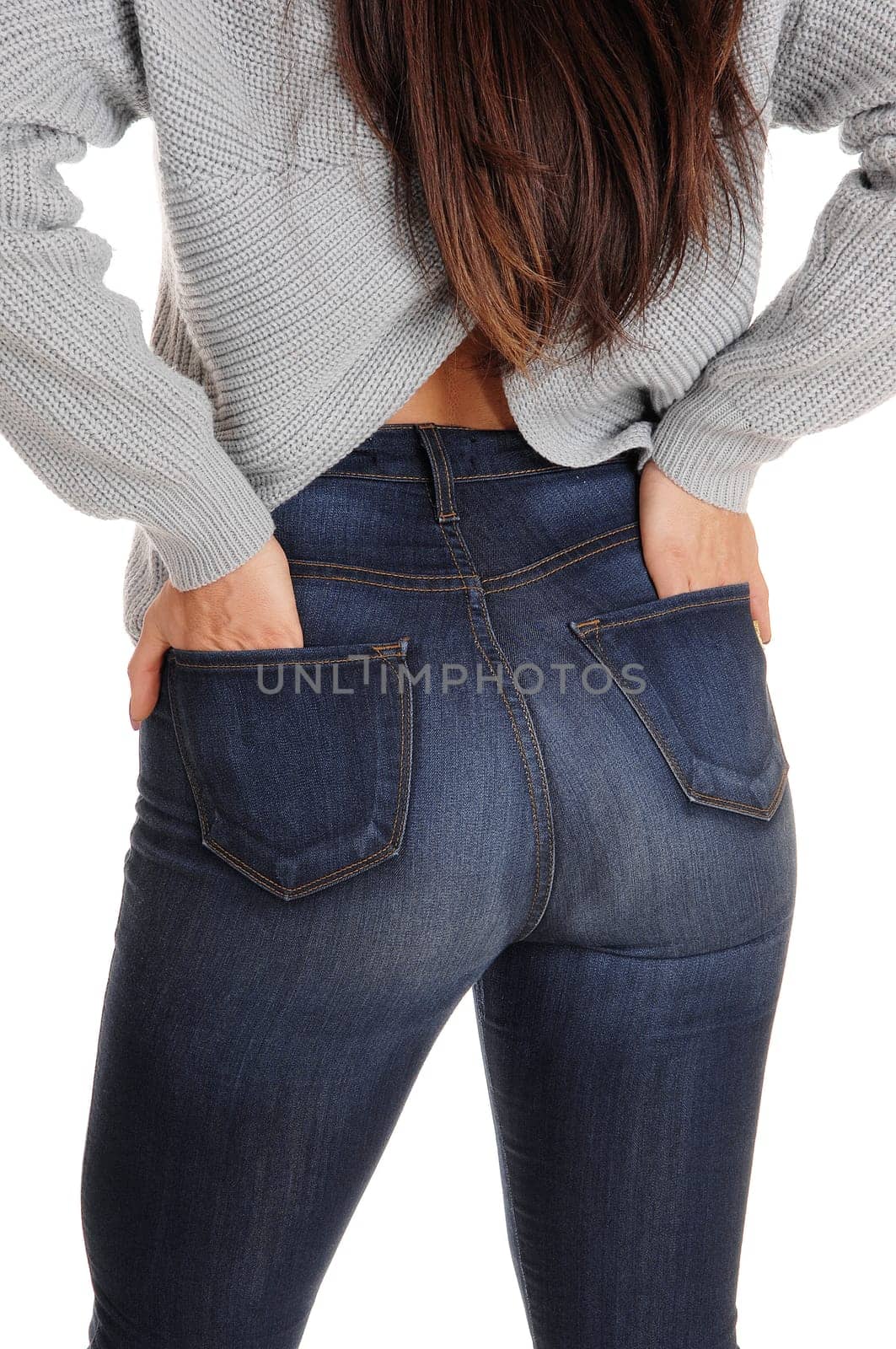 A close up image of the butt of a young woman in jeans, standing from.the back, showing her great figure, isolated for white background.