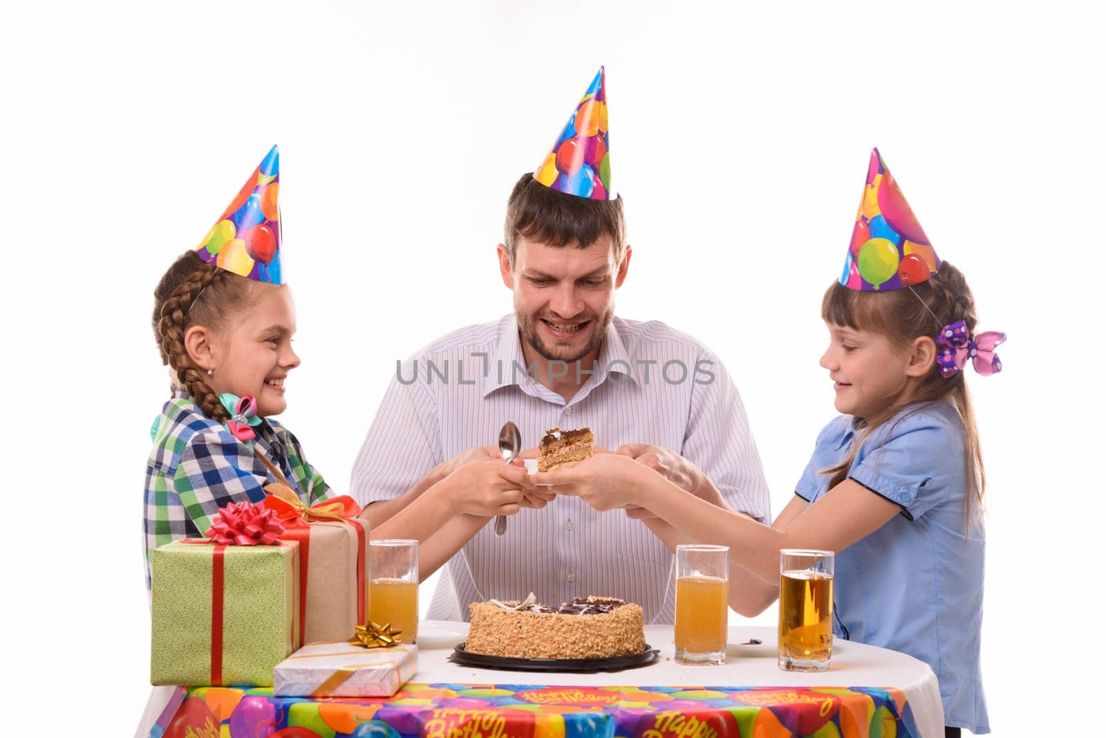 Children fight for the first piece of birthday cake