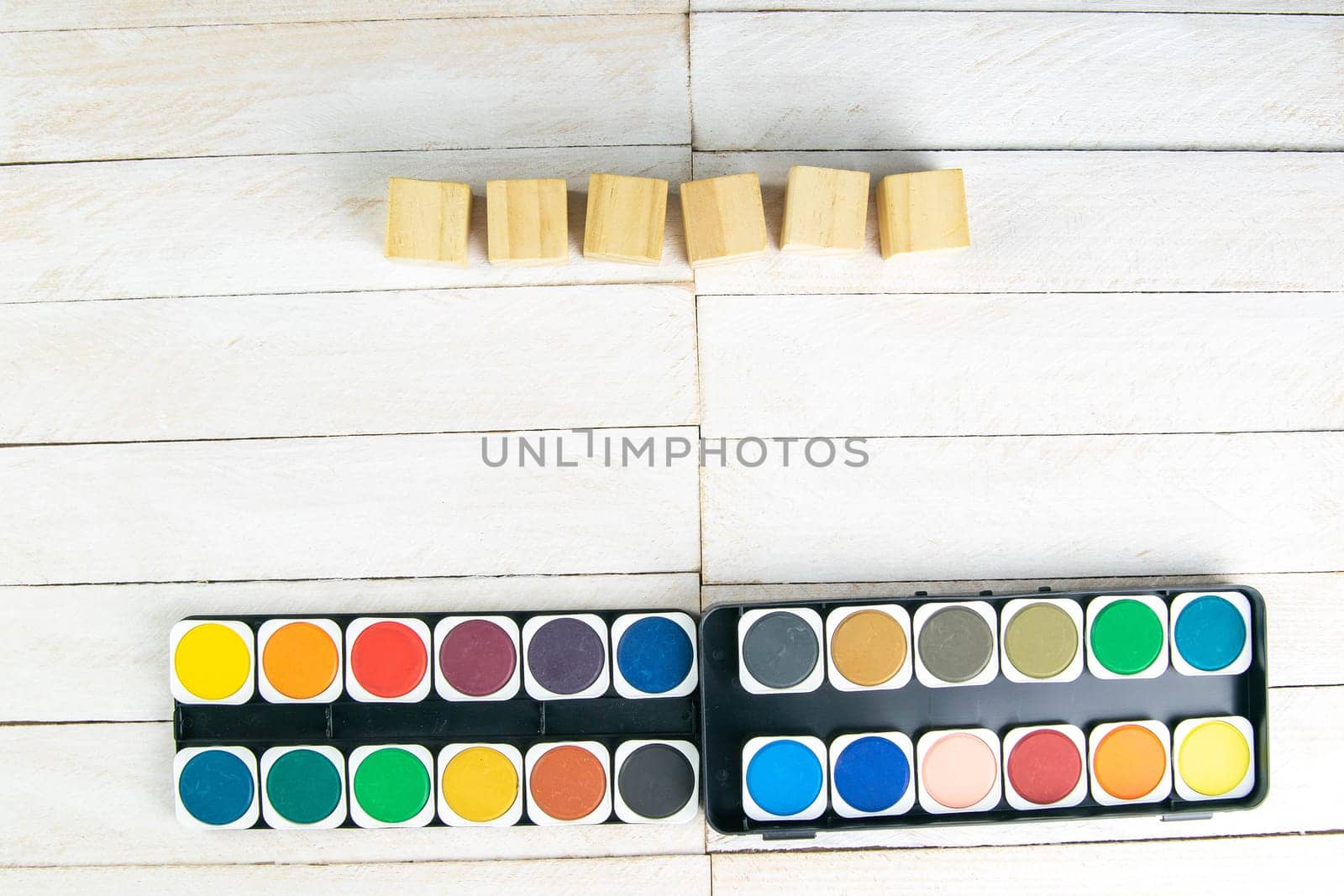 Top view on colorful paints and brushes. Creative ideas, creativity and early learning. Education concept.