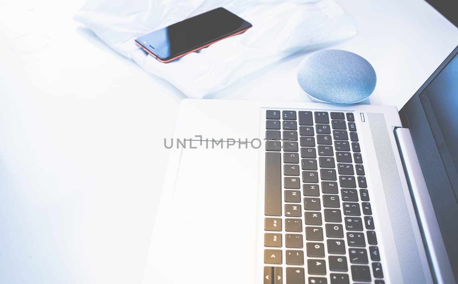 Home Office - PC, blouse, mobile phone and voice assistant, work at home.