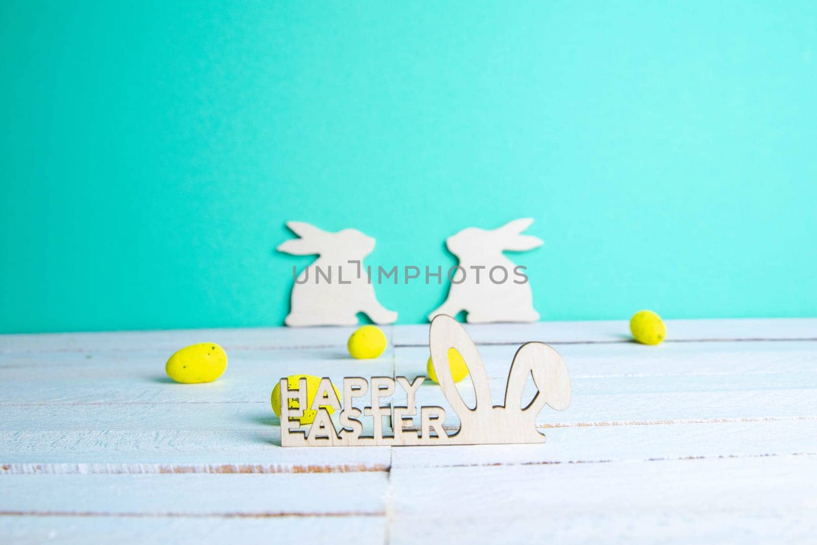 Easter holiday background. Easter bunny, eggs and text Happy Easter. Minimal modern concept.