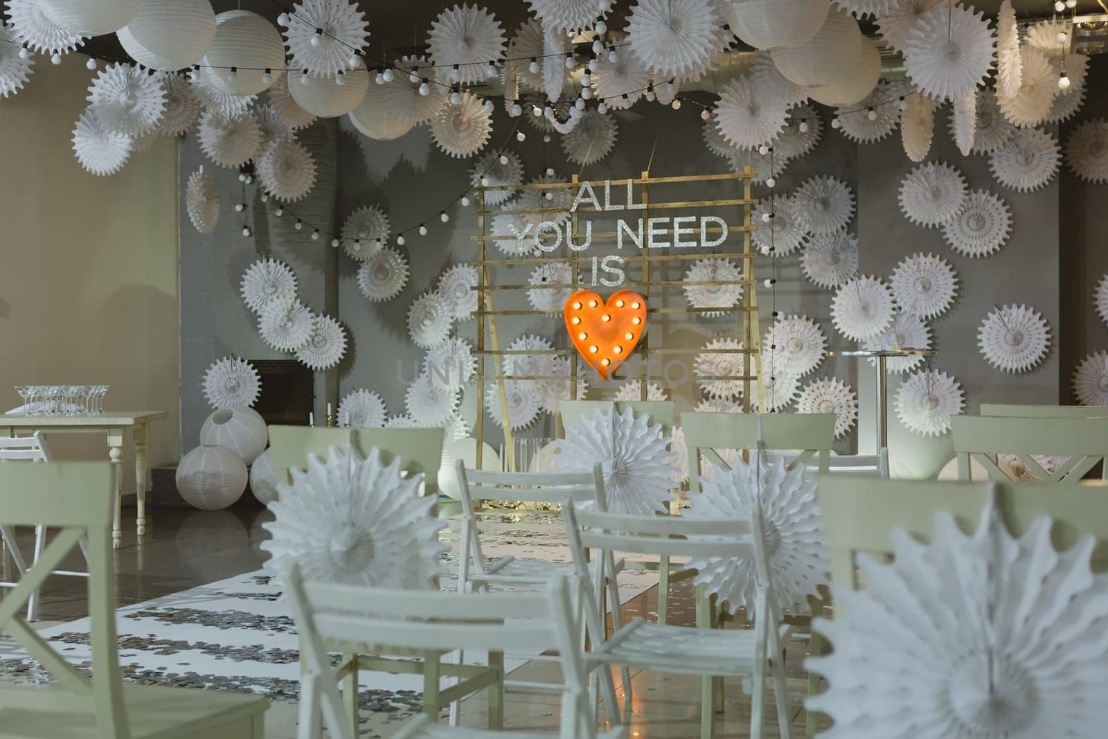 wooden arch and chairs at wedding ceremony