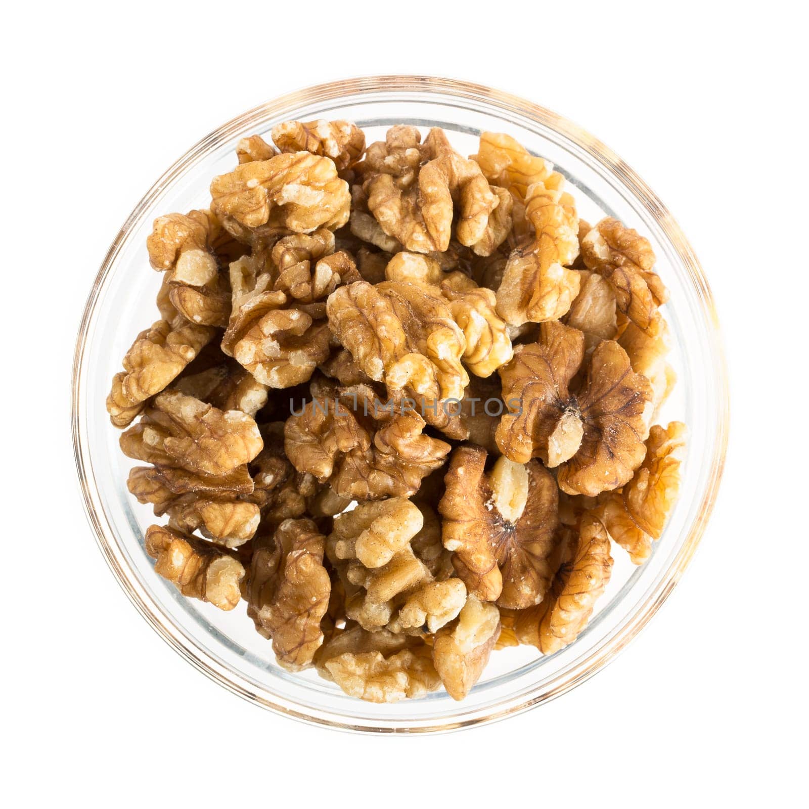 Walnuts in bowl isolated on white.