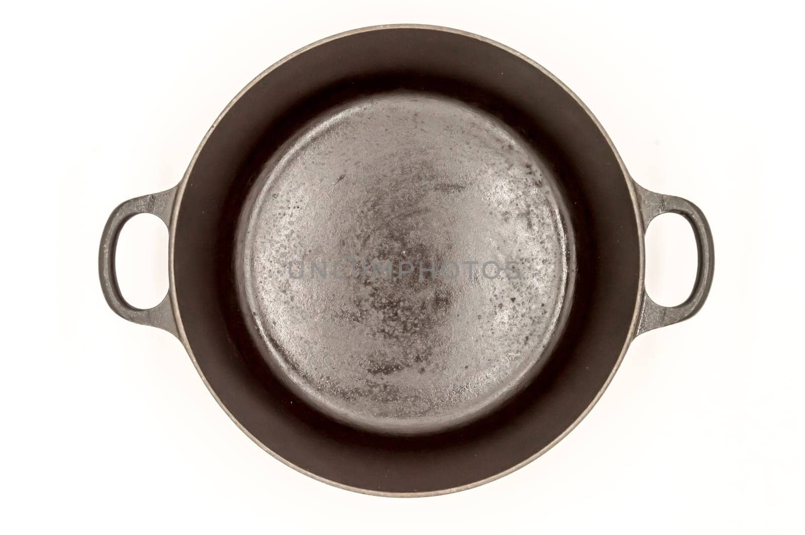 Cast iron pan with two handles top view on a white background