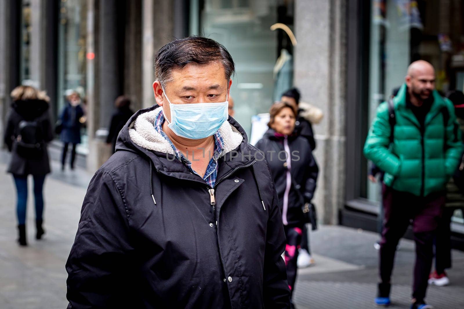 MADRID, SPAIN  - March 3: Unidentified man wearing mask to protect himself and others from coronavirus. March 3, 2020 in Madrid, Spain.