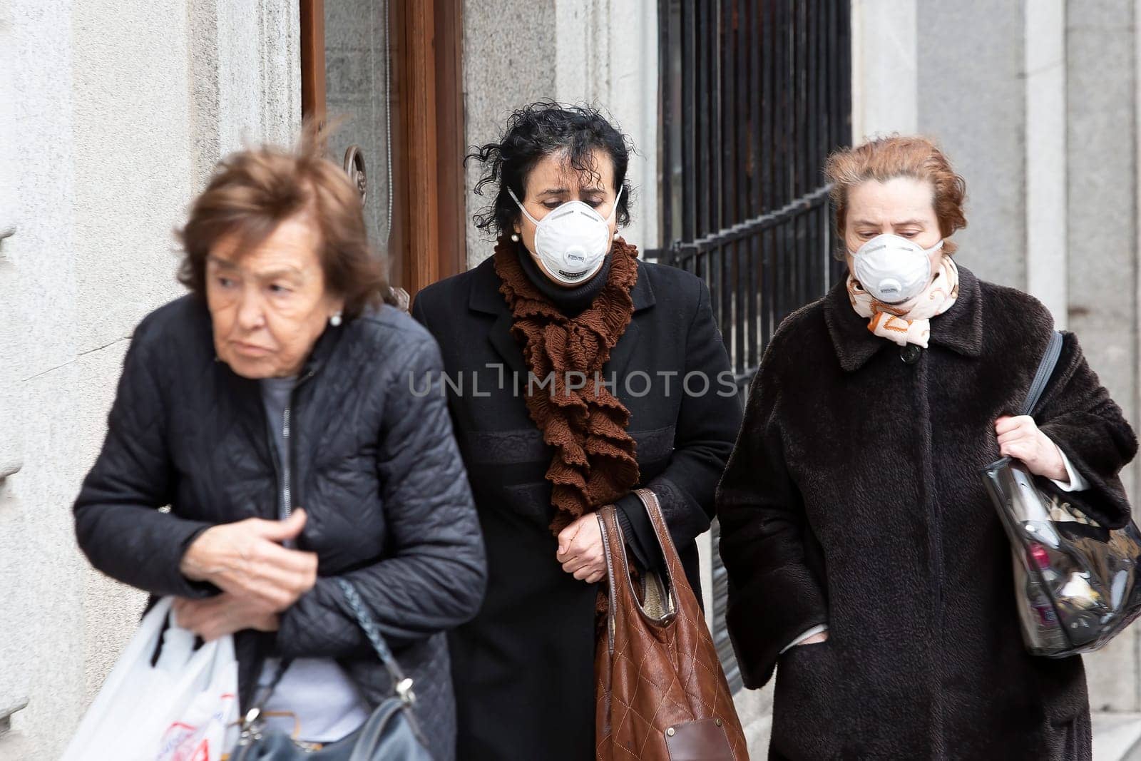 TOLEDO, SPAIN  - March 5: Unidentified women wearing masks to protect themselves and others from coronavirus. March 5, 2020 in Toledo, Spain.