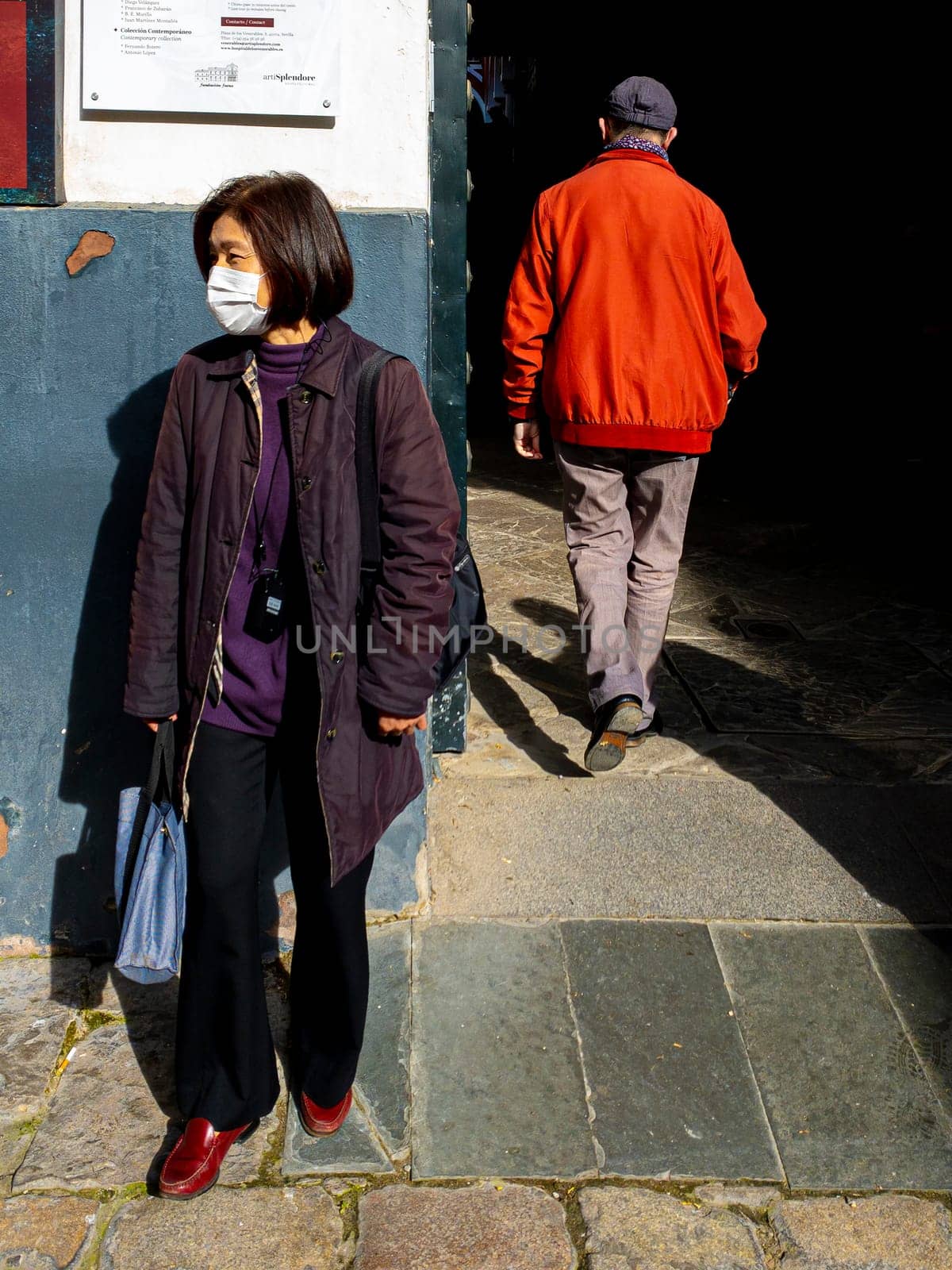 SEVILLE, SPAIN  - March 7: Unidentified woman wearing mask to protect herself and others from coronavirus. March 7, 2020 in Seville, Spain.