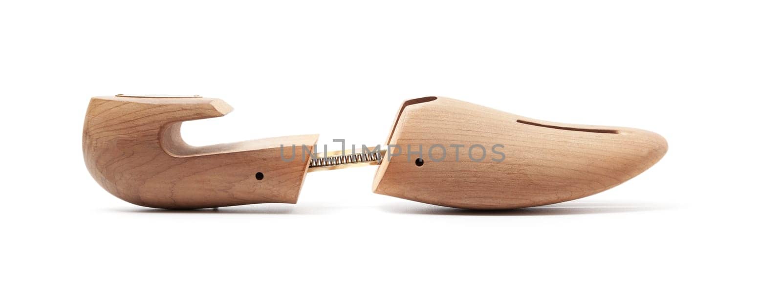 Wood shoe tree. Close up isolated on white background