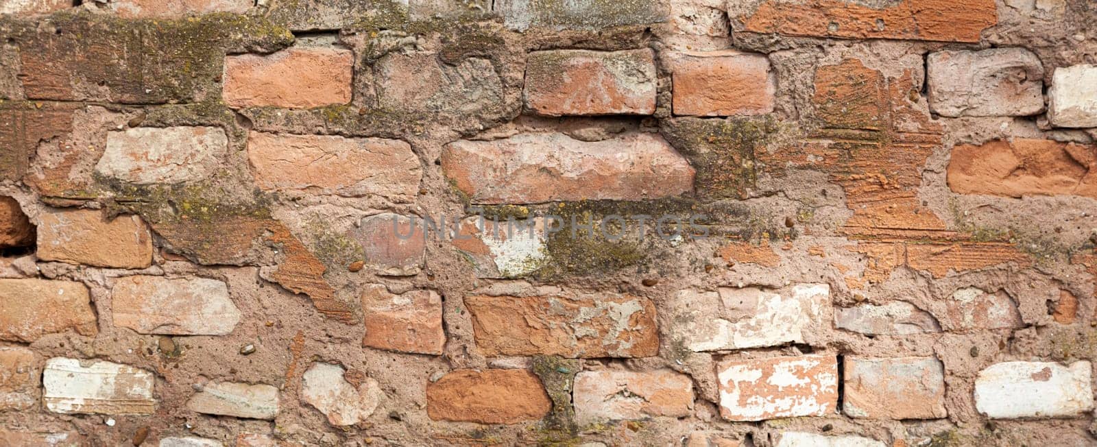 Red old worn brick wall texture background. Vintage effect. Background Close-up