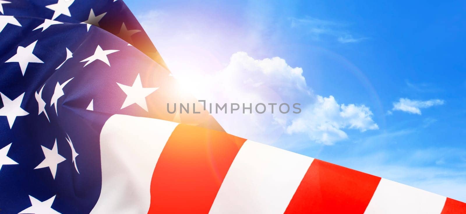 American flag on the background of the dawn sky. Top view, copy space for text.