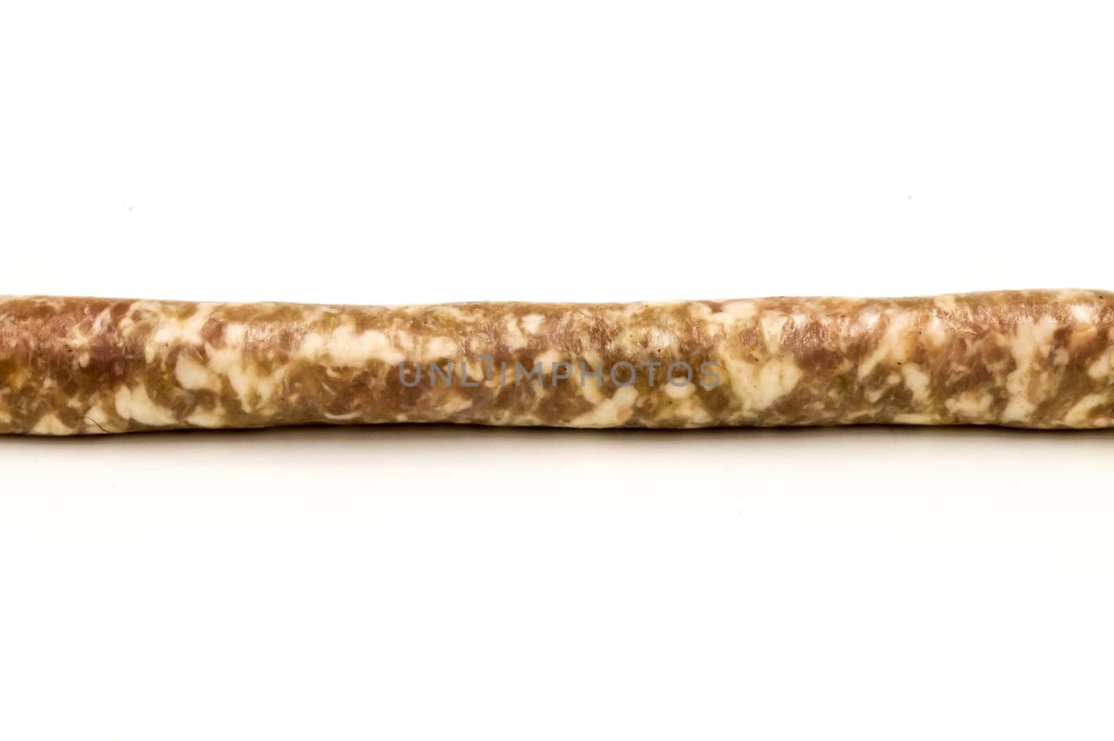 Small straight sausage in length on a white background