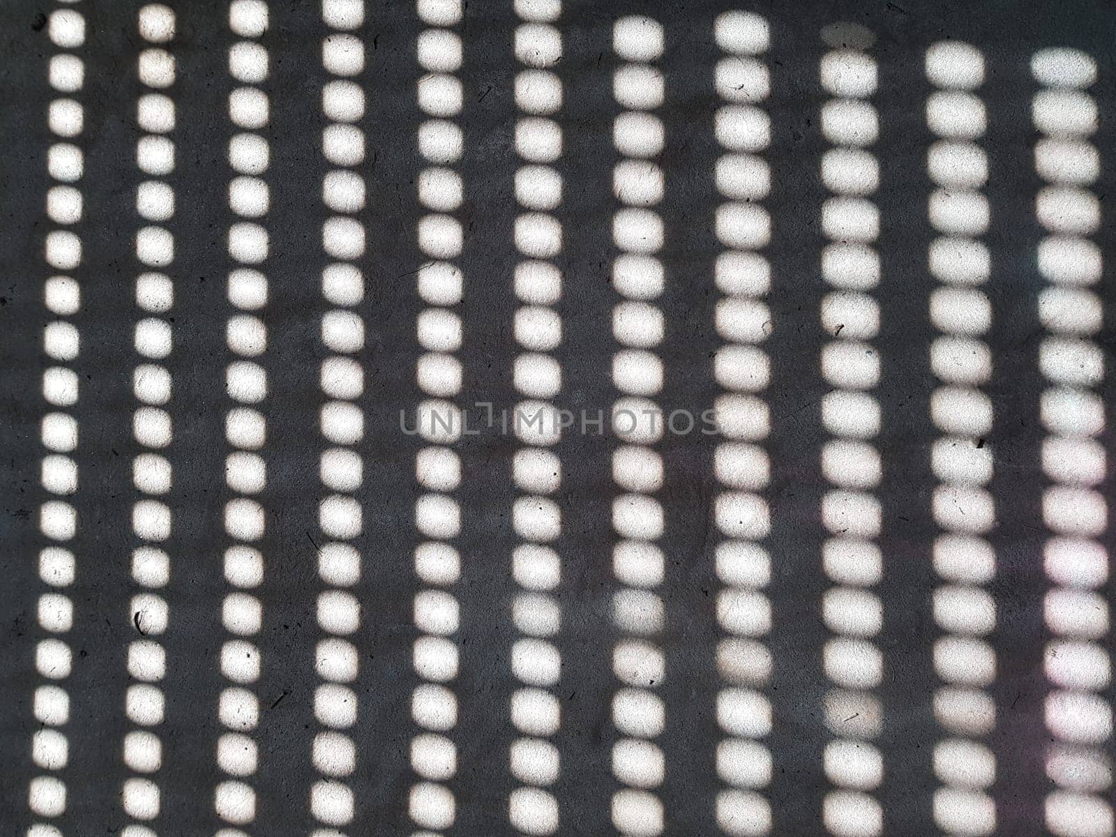 Grid of light. Obtained by penetrating the sun through holes in the shutters.