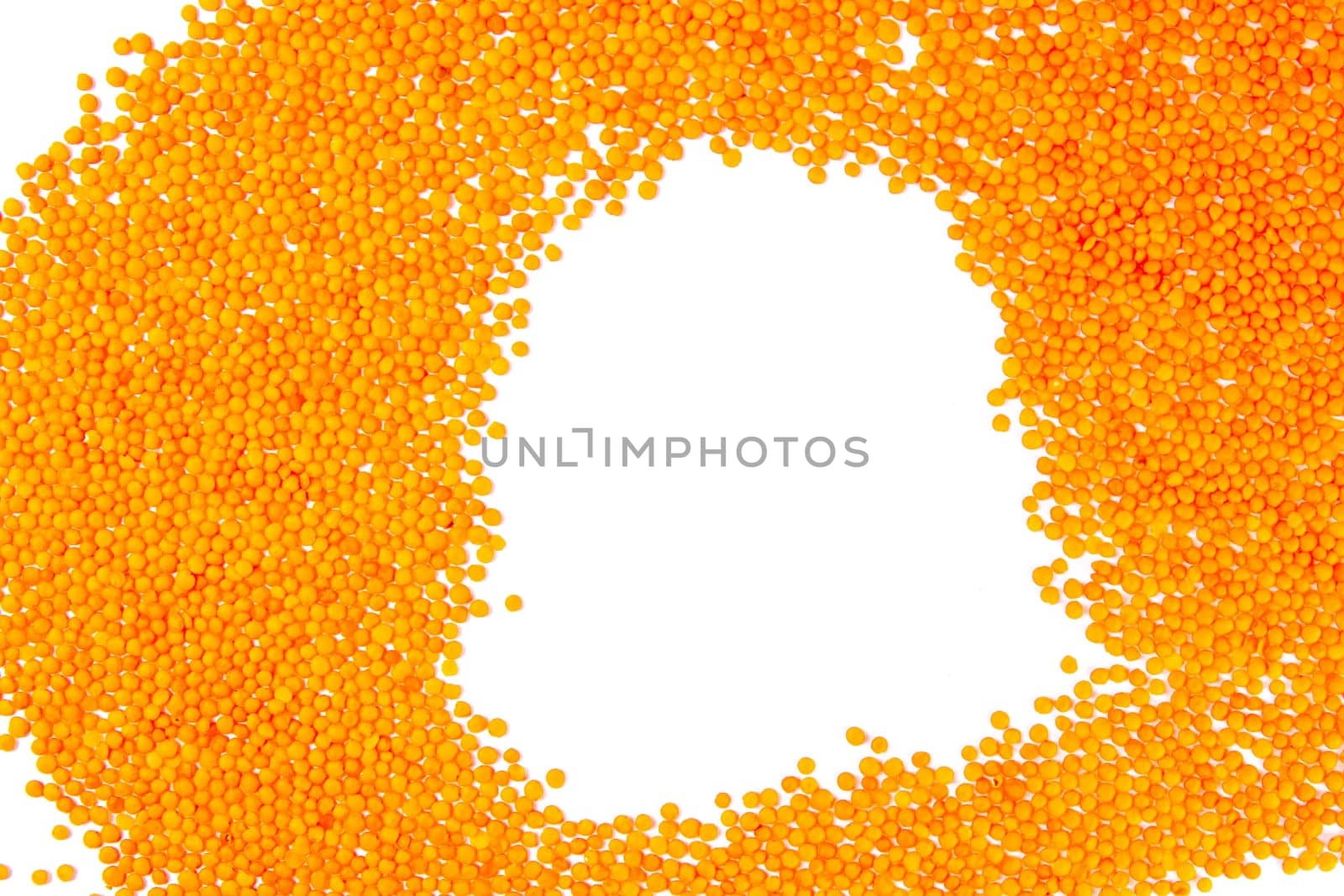 Red lentils on a white background. Top views.