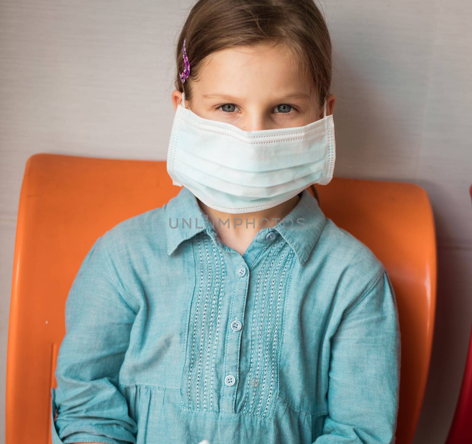 Girl wearing facial disposable mask to avoid viral infection. Virus protection