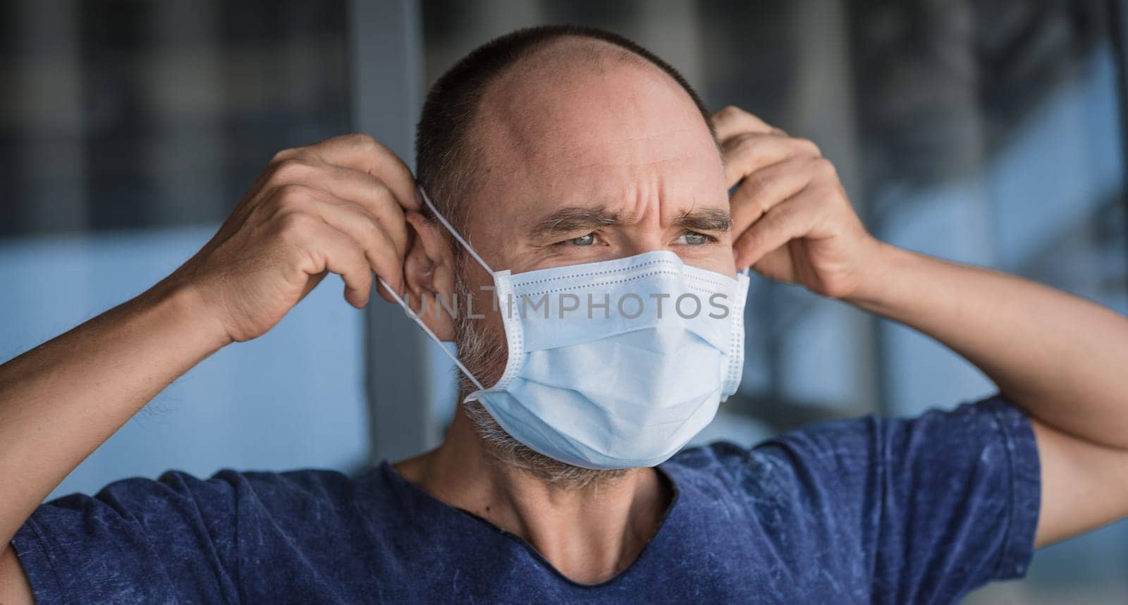 Man wearing facial disposable mask to avoid viral infection. Virus protection