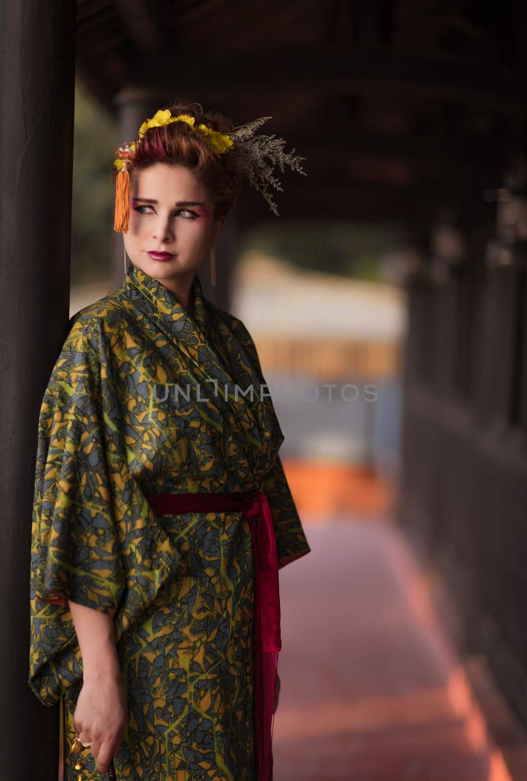 Fine art portrait of beautiful woman in Japanese Geisha style wearing kimono