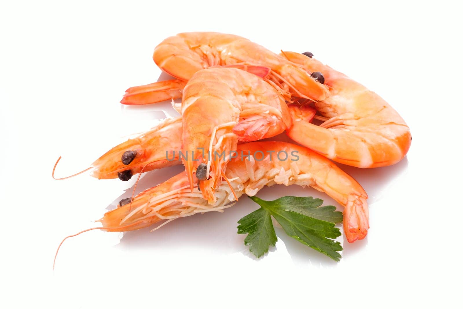 Crevettes prawns shrimps on a heap white isolated