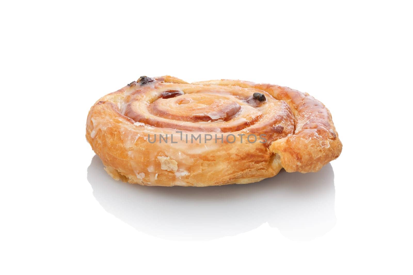 Cinnamon roll or sugar snail sweet with raisins