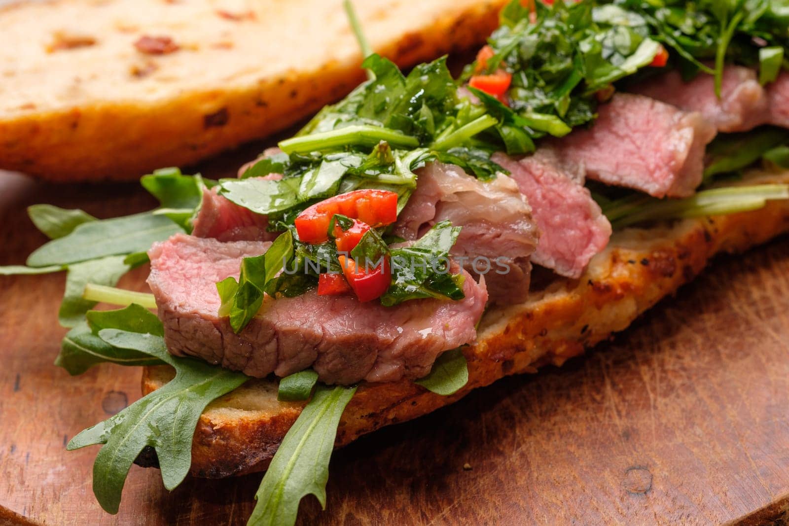 Beef sous vide with chmichulli herbs chili sauce Sandwich