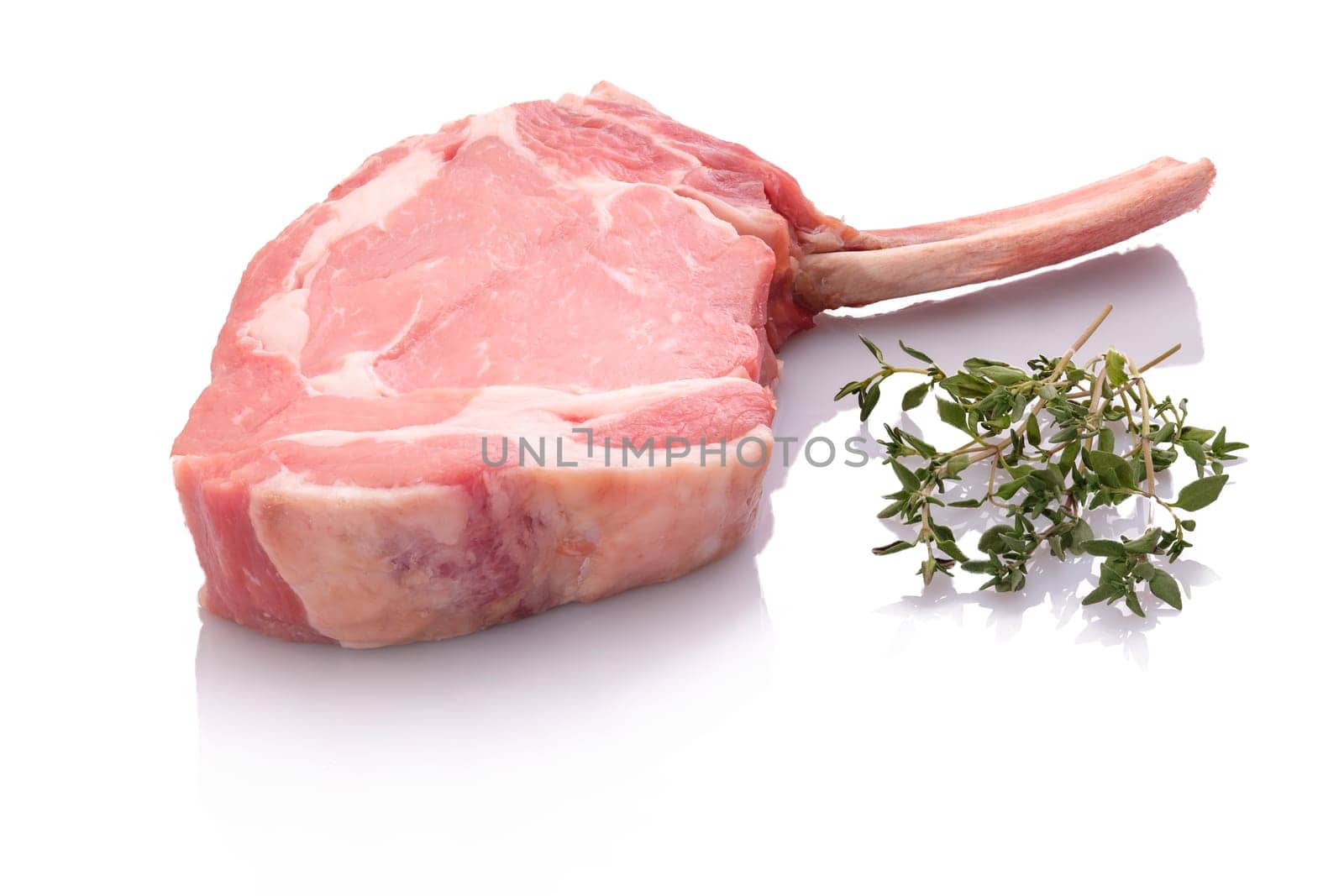 Veal cutlet with bone and herbs white isolated