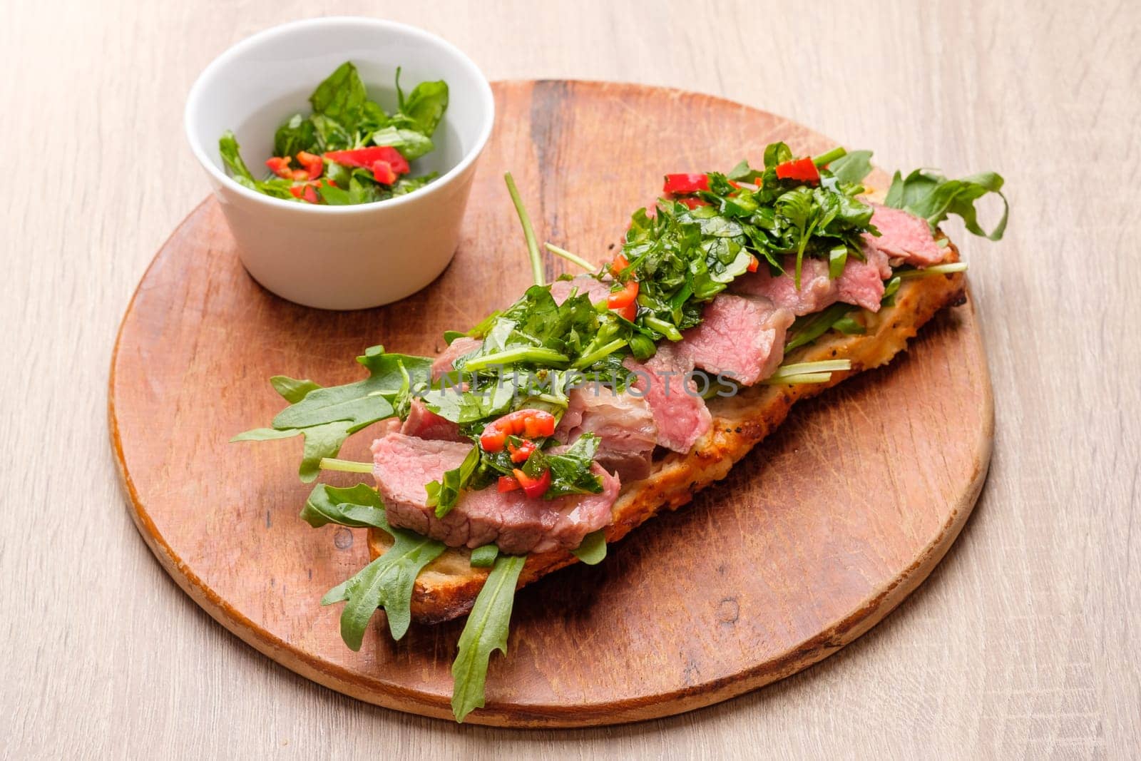 Baguette Sandwich with soud vide beef steak and chimichurri herb sauce