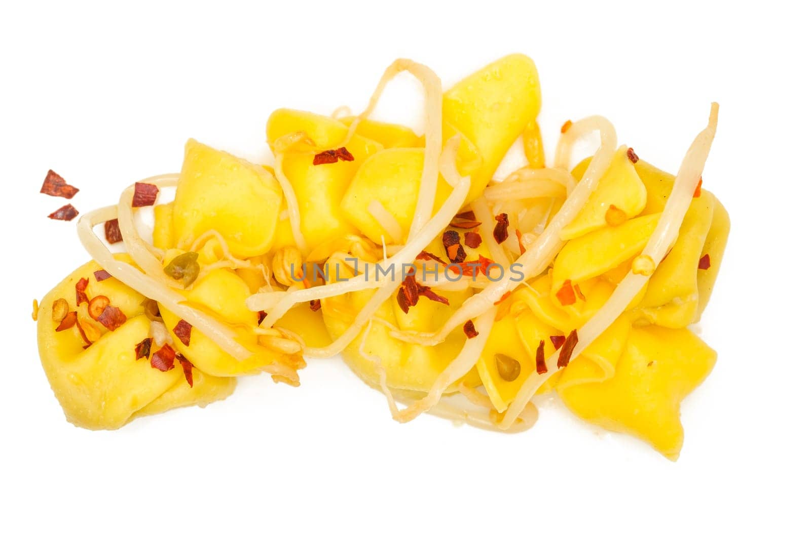 Tortellini with chili and mung beans white isolated