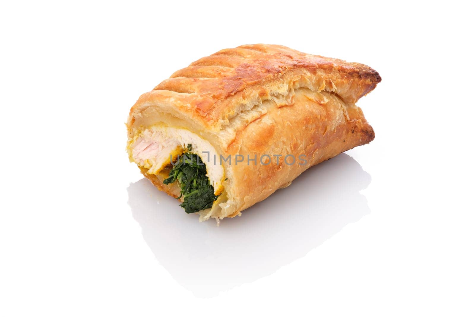 Turkey breast with spinach in puff pastry coat white isolated