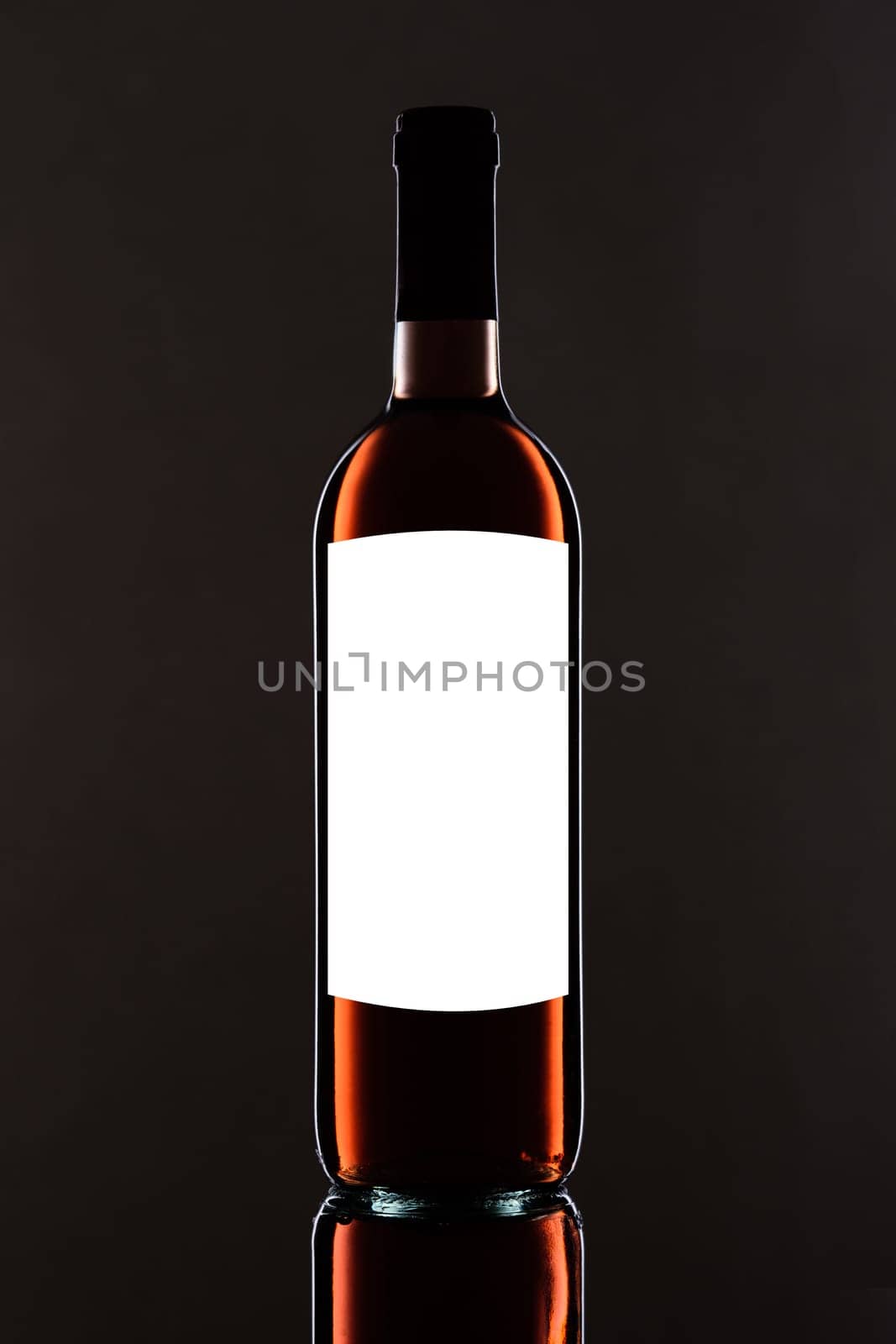 Red wine bottle with blank label and white text space