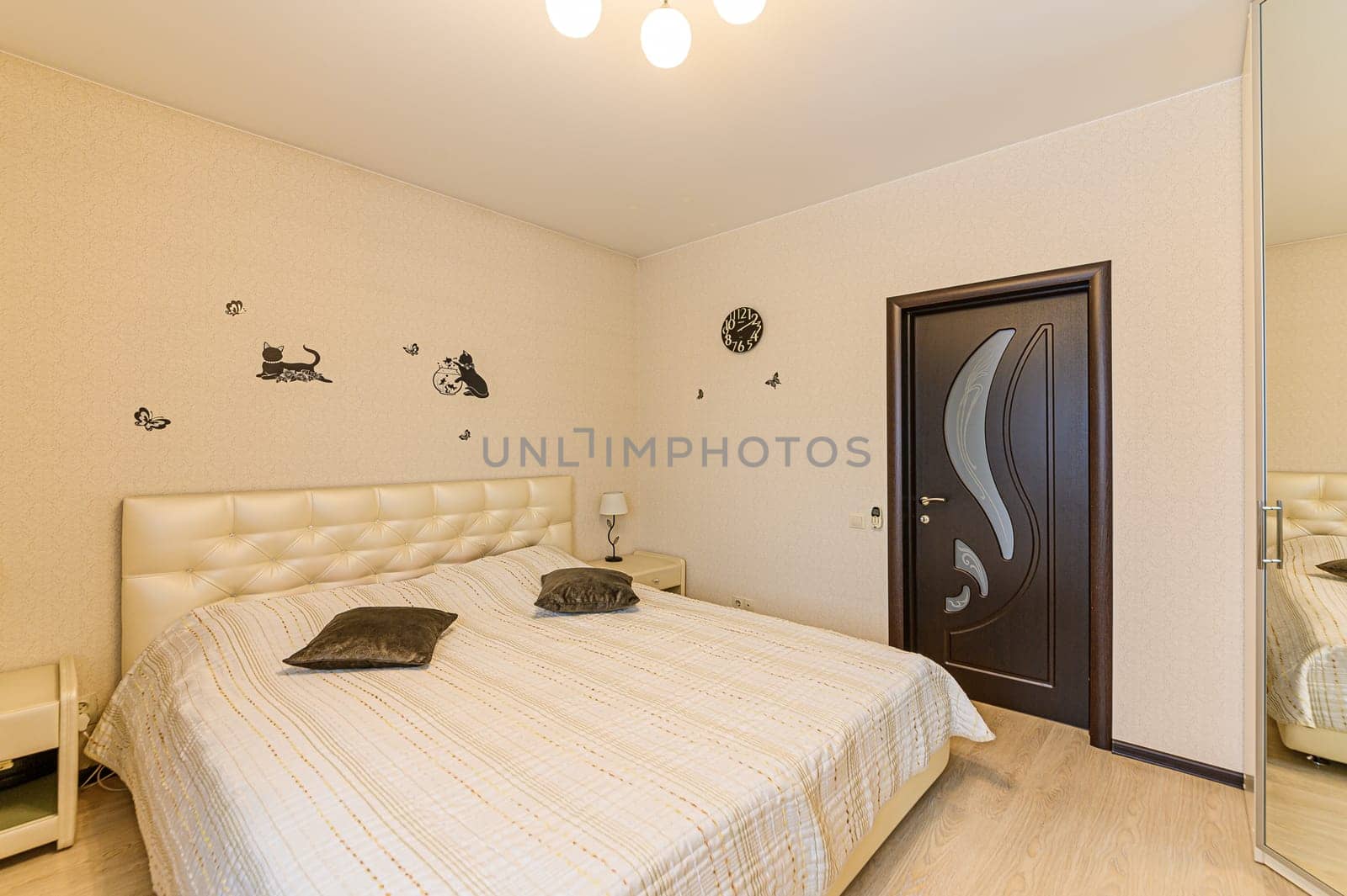 Russia, Moscow- December 05, 2019: interior room apartment modern bright cozy atmosphere. general cleaning, home decoration, preparation of house for sale. bedroom with bed