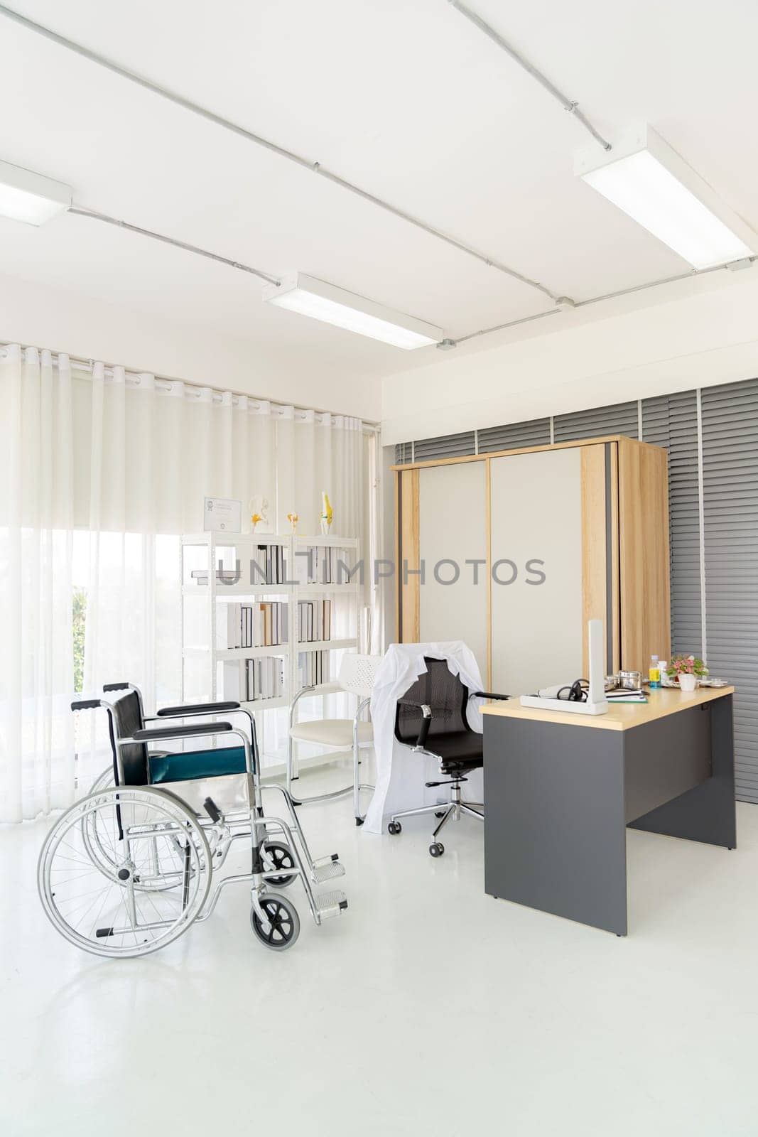 Interior of empty doctor office examination room workplace with equipment in clinic medical hospital of state health care center. Using for healthcare hospital industry concept.