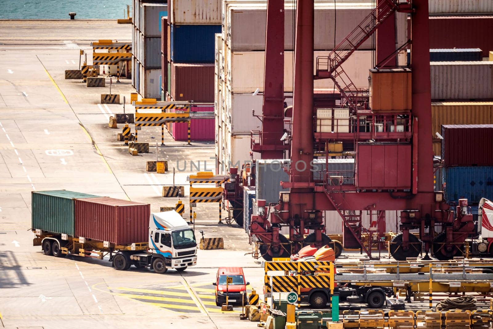 Working at Tsing yi Hong Kong Port for shipping and freight transportation with truck and boat for global business import and export background