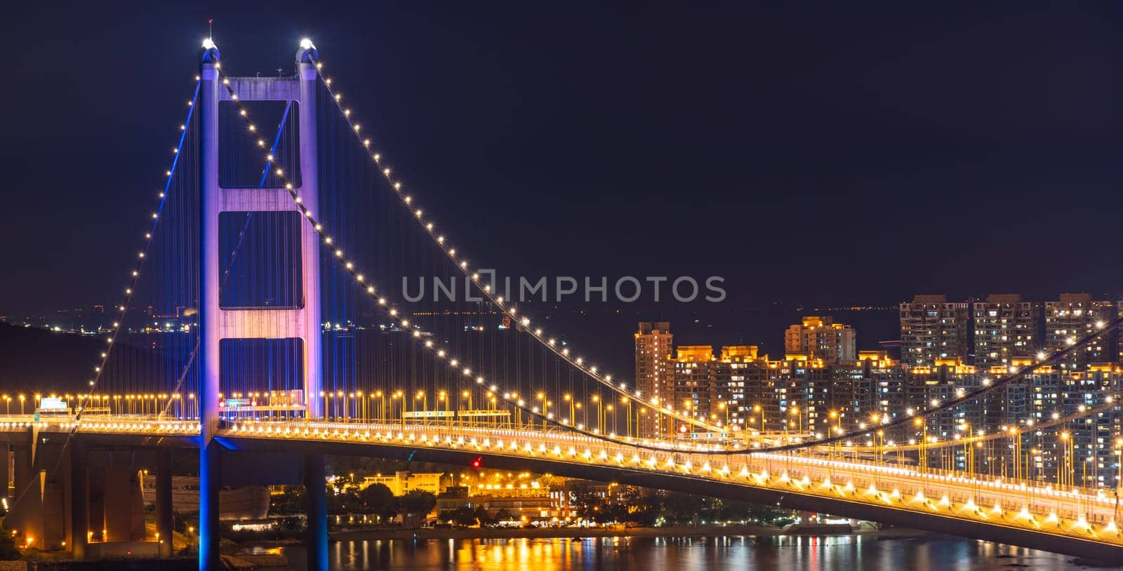 Sunset and light illumination of Tsing ma bridge landmark suspension bridge in Tsing yi area of Hong Kong China.