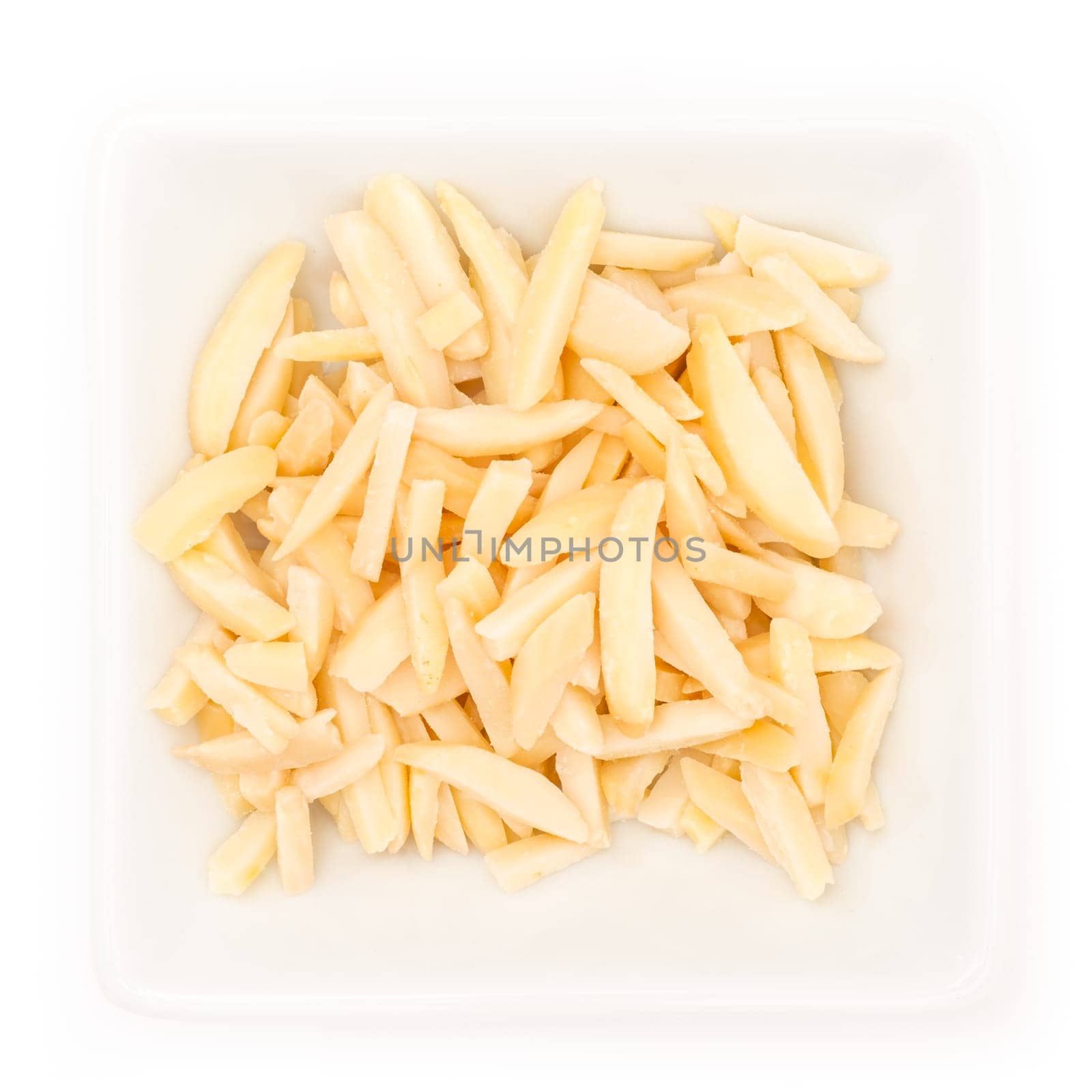 Almond sticks in a square bowl in top view