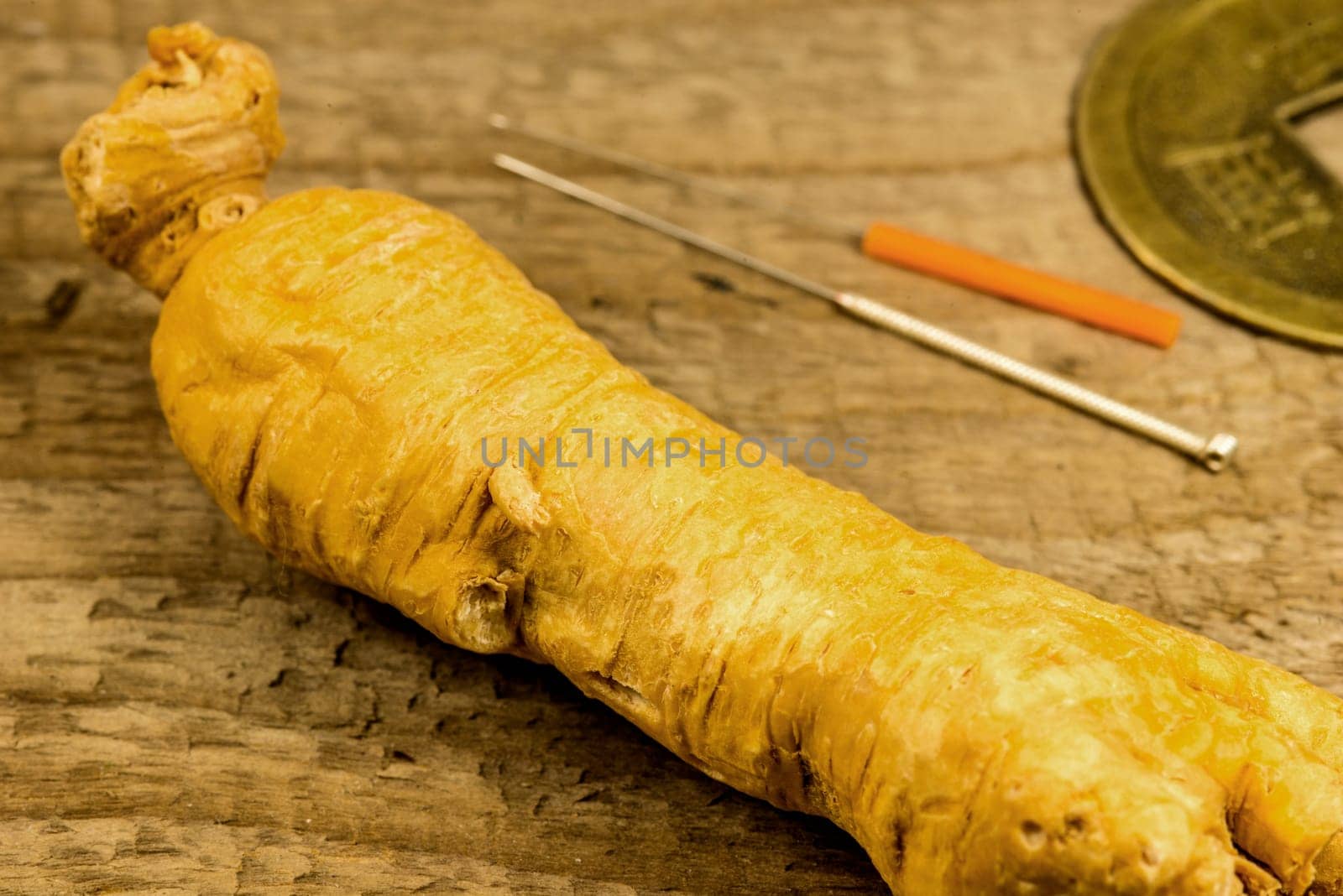 ginseng root and acupunture needles