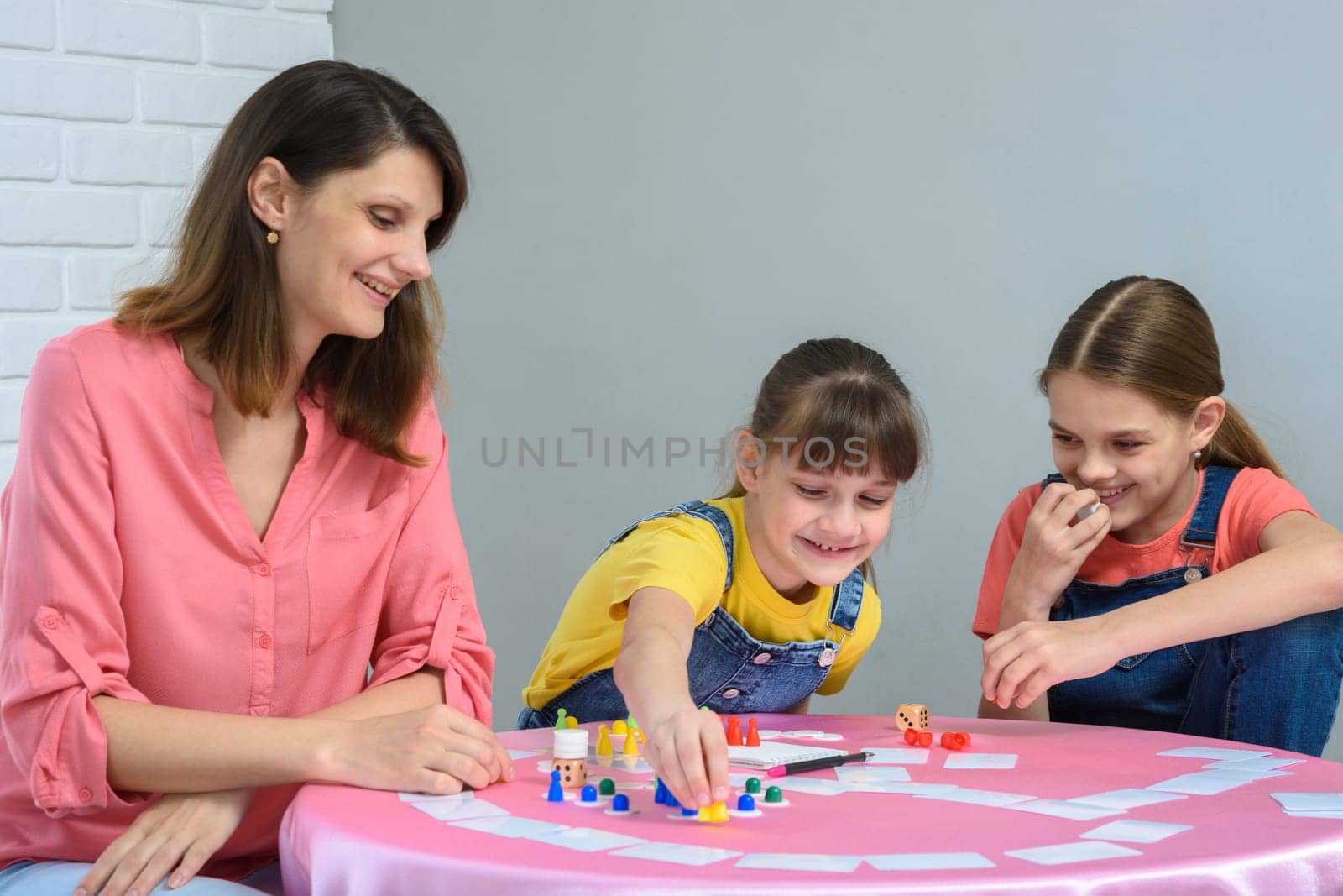 Girl makes another move playing a board game